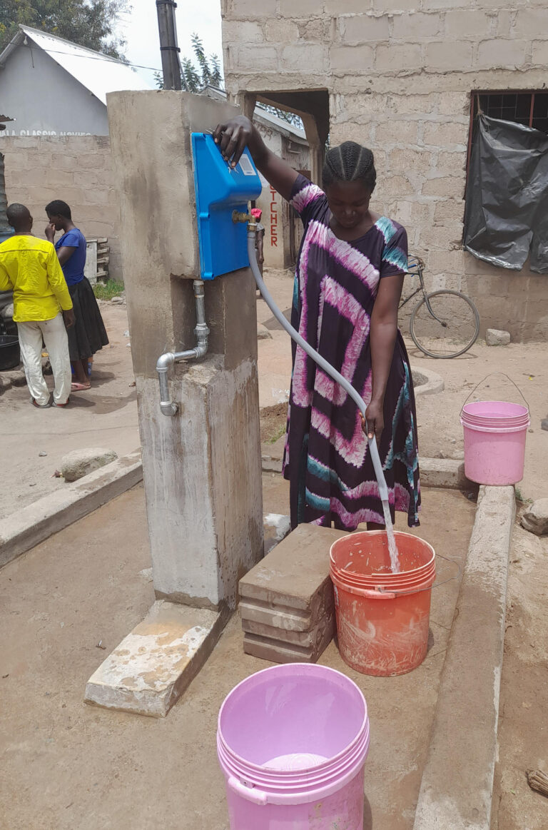 Woman uses WaterSpout to fill bucket